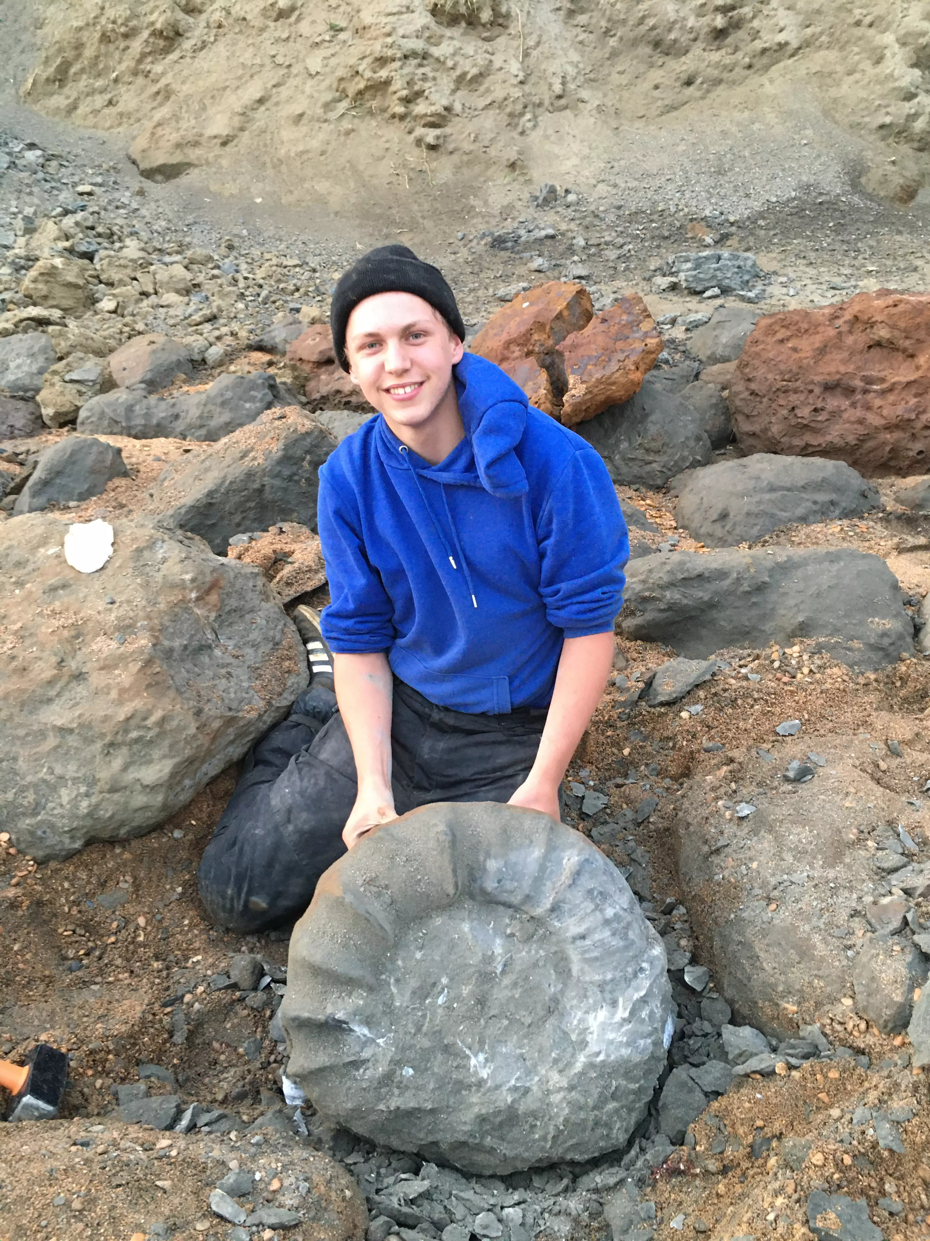 You've both got to have a picture when you find an ammonite this big. That's the rule.