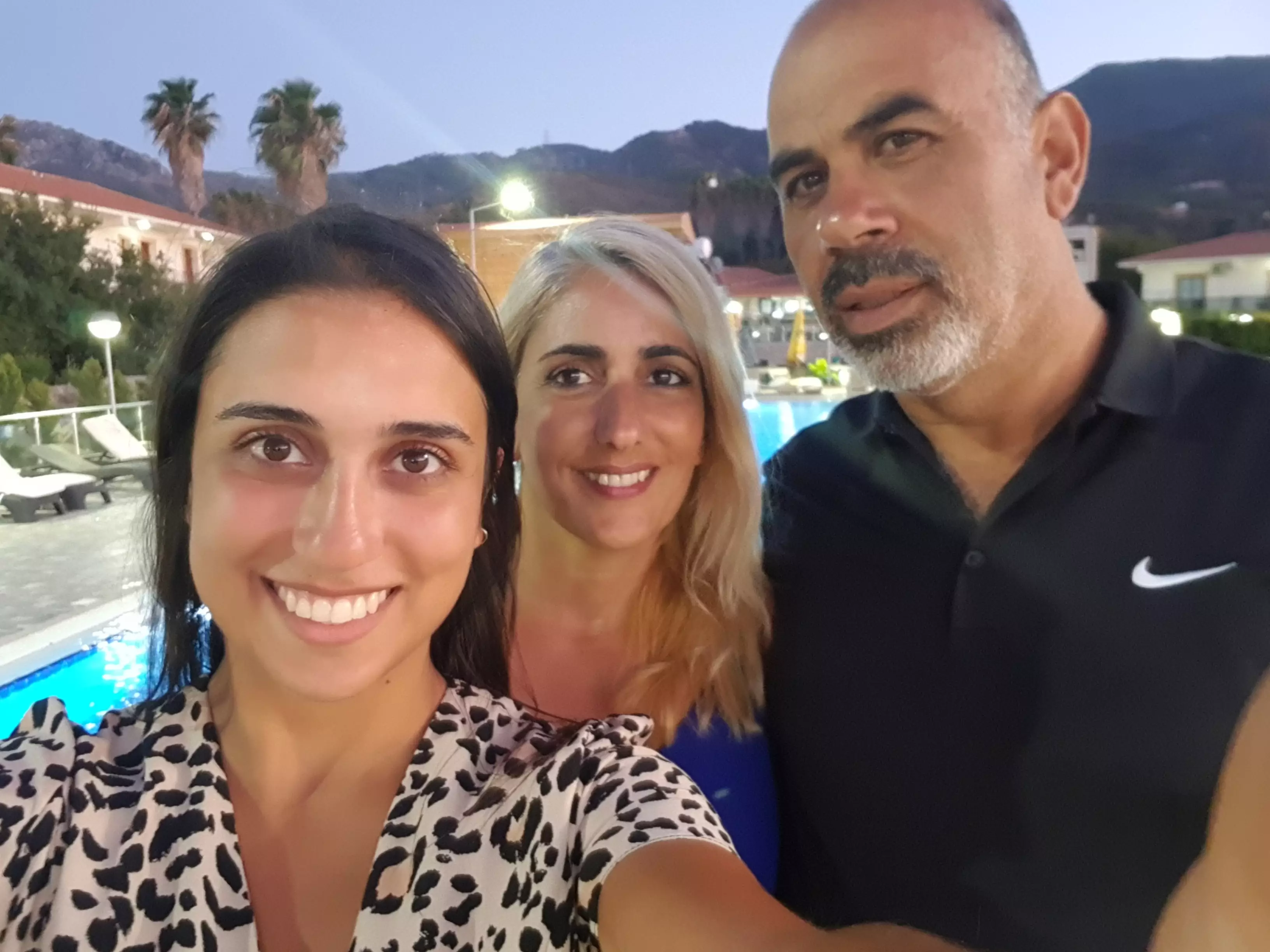 Cigdem pictured on holiday with her parents (