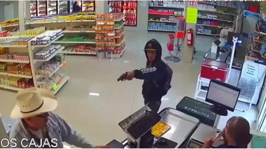 CCTV Captures Heart-Stopping Moment Cowboy Takes Down Armed Robber In Store