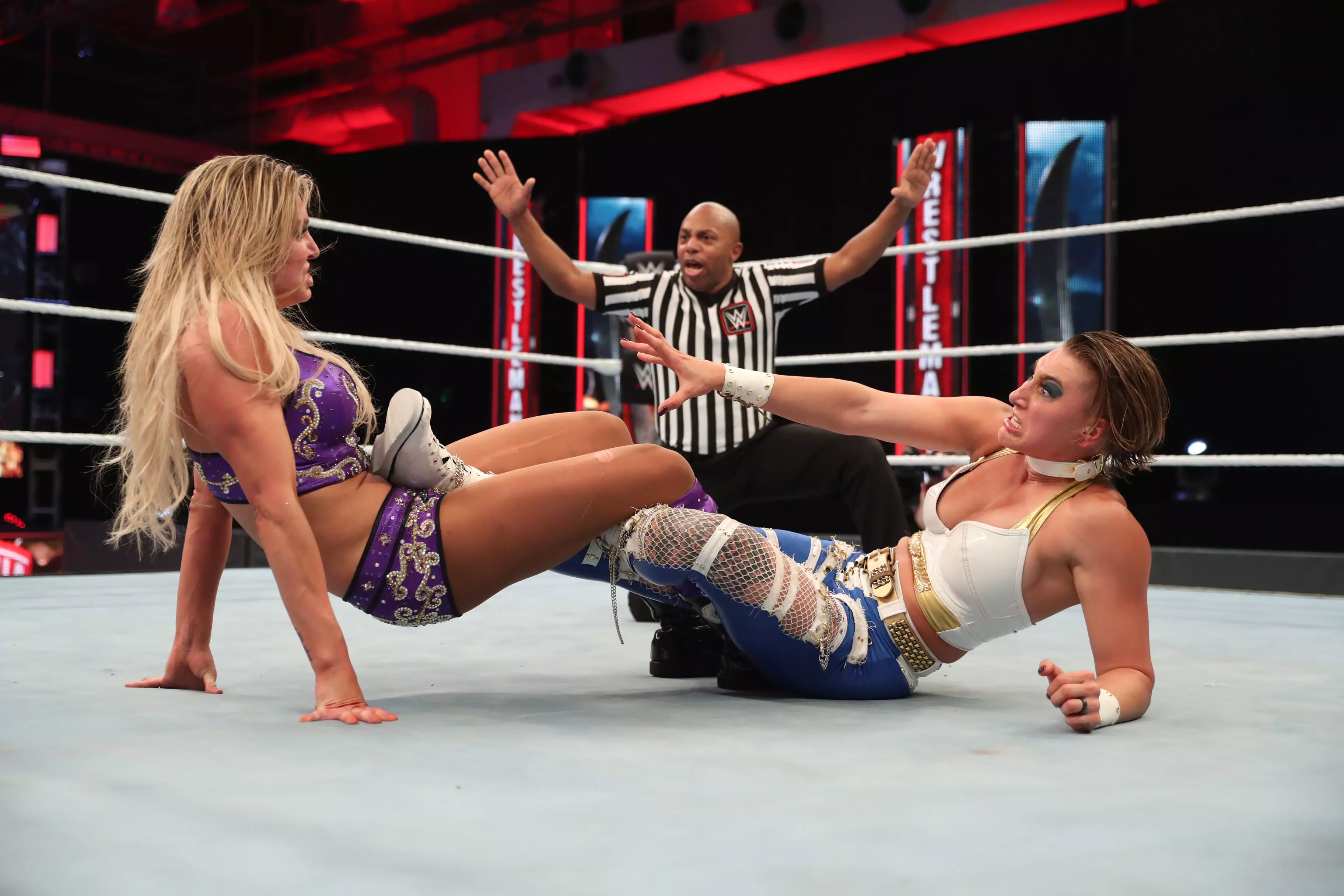 Charlotte (L) made Rhea Ripley (R) tap to the Figure Eight on Sunday night. (Image