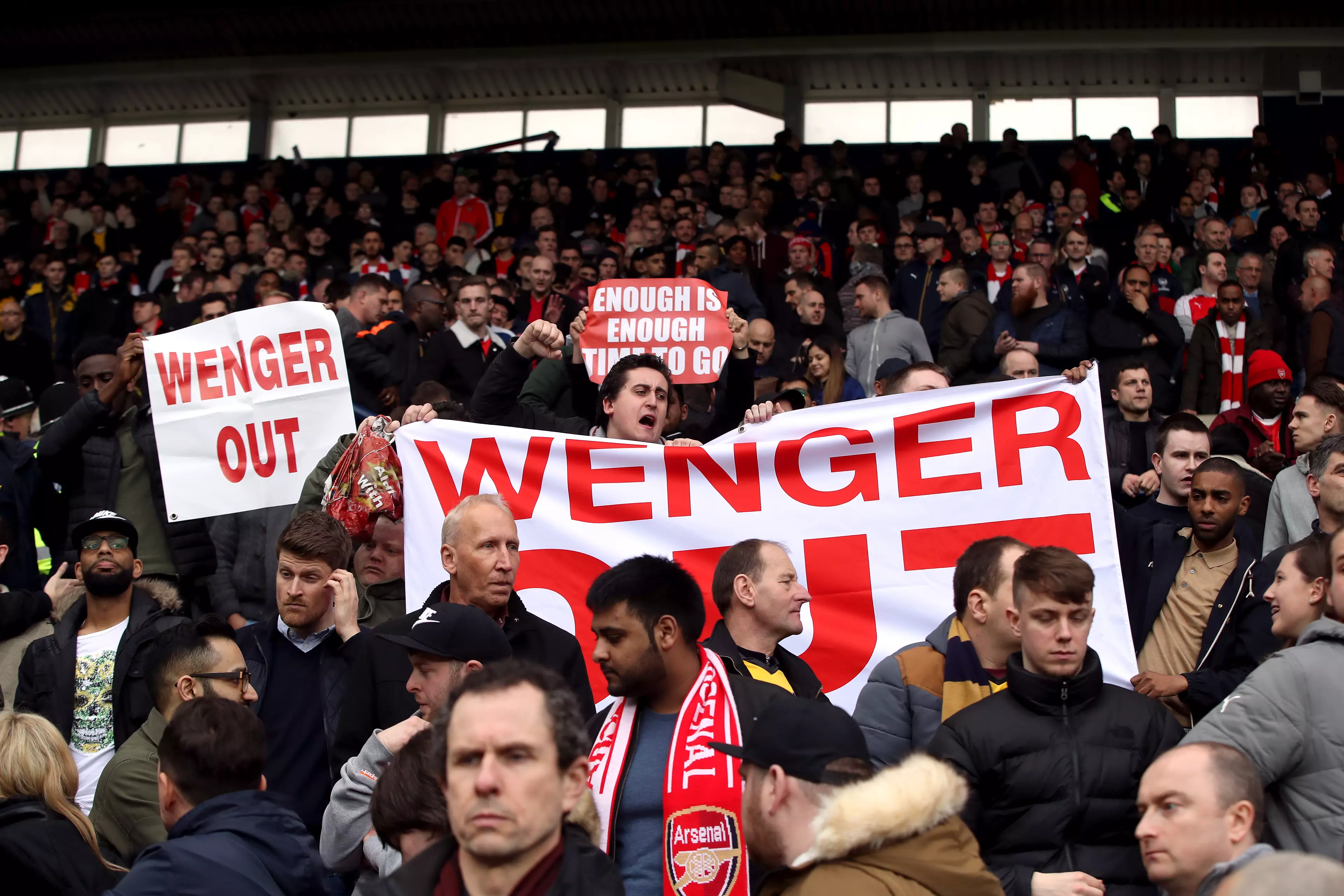 Wenger out signs started to follow the team everywhere. Image: PA Images