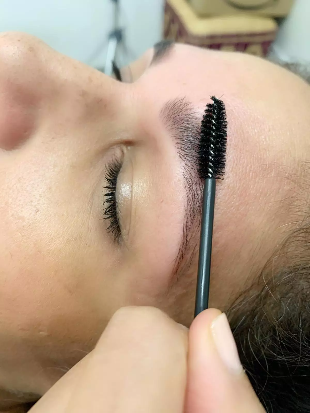 Before applying the tint, brush your brows in an upward motion (