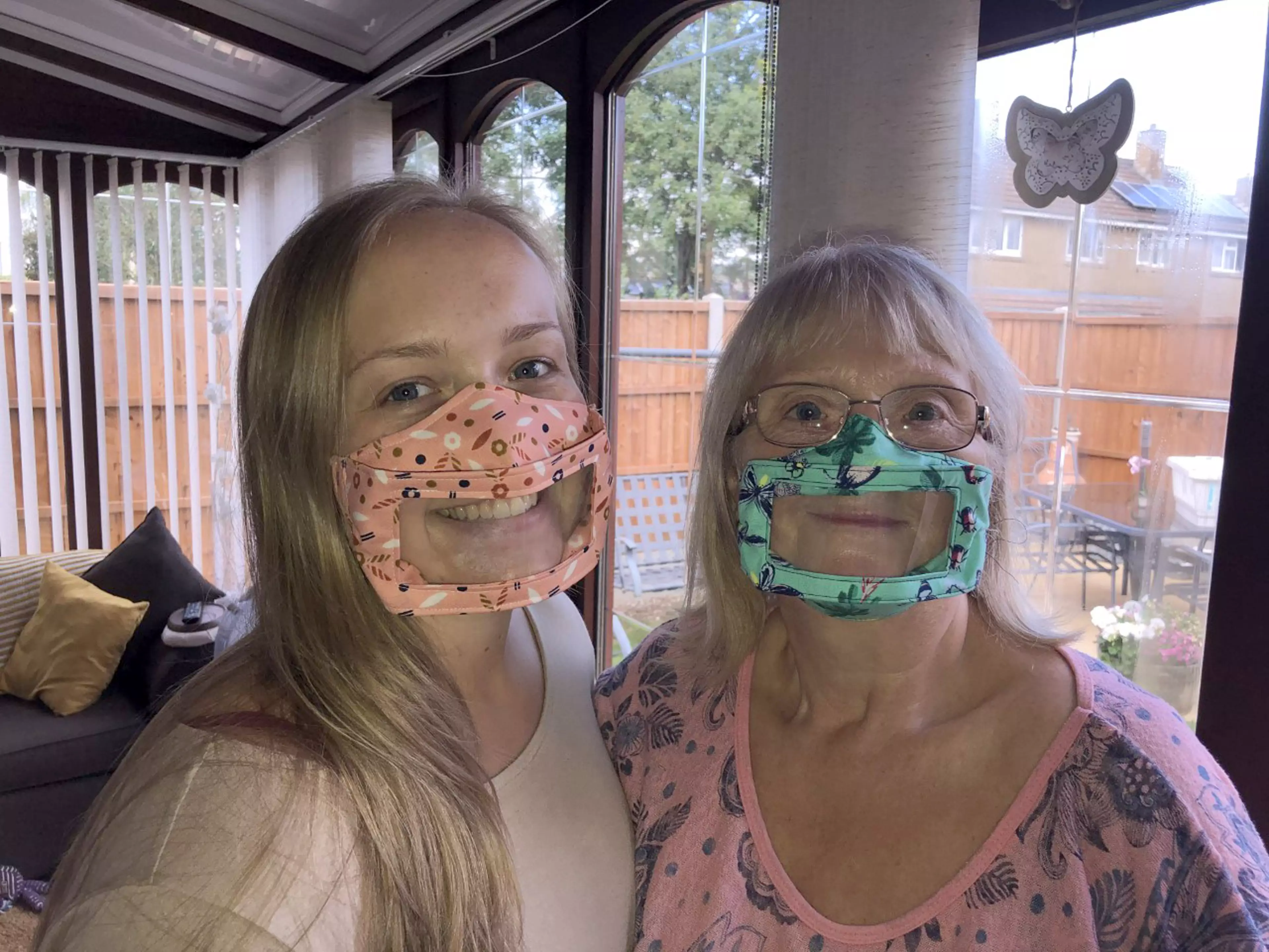 Julie, right, invented the clever face masks to help the hard of hearing (