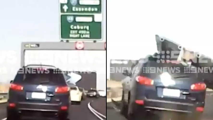 Dashcam Captures Horrifying Moment Highway Sign Falls Onto Car