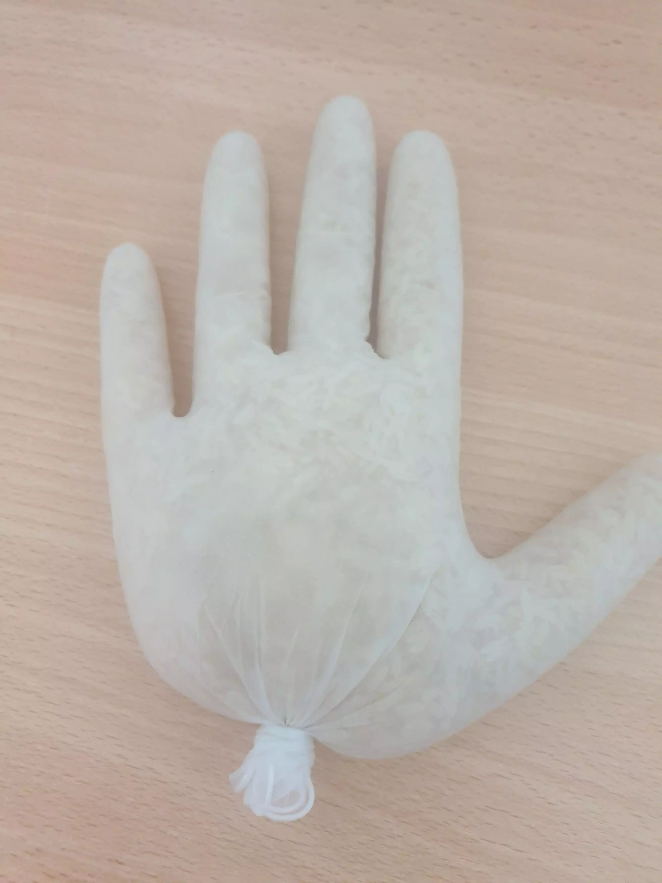 The mum filled a glove with rice (