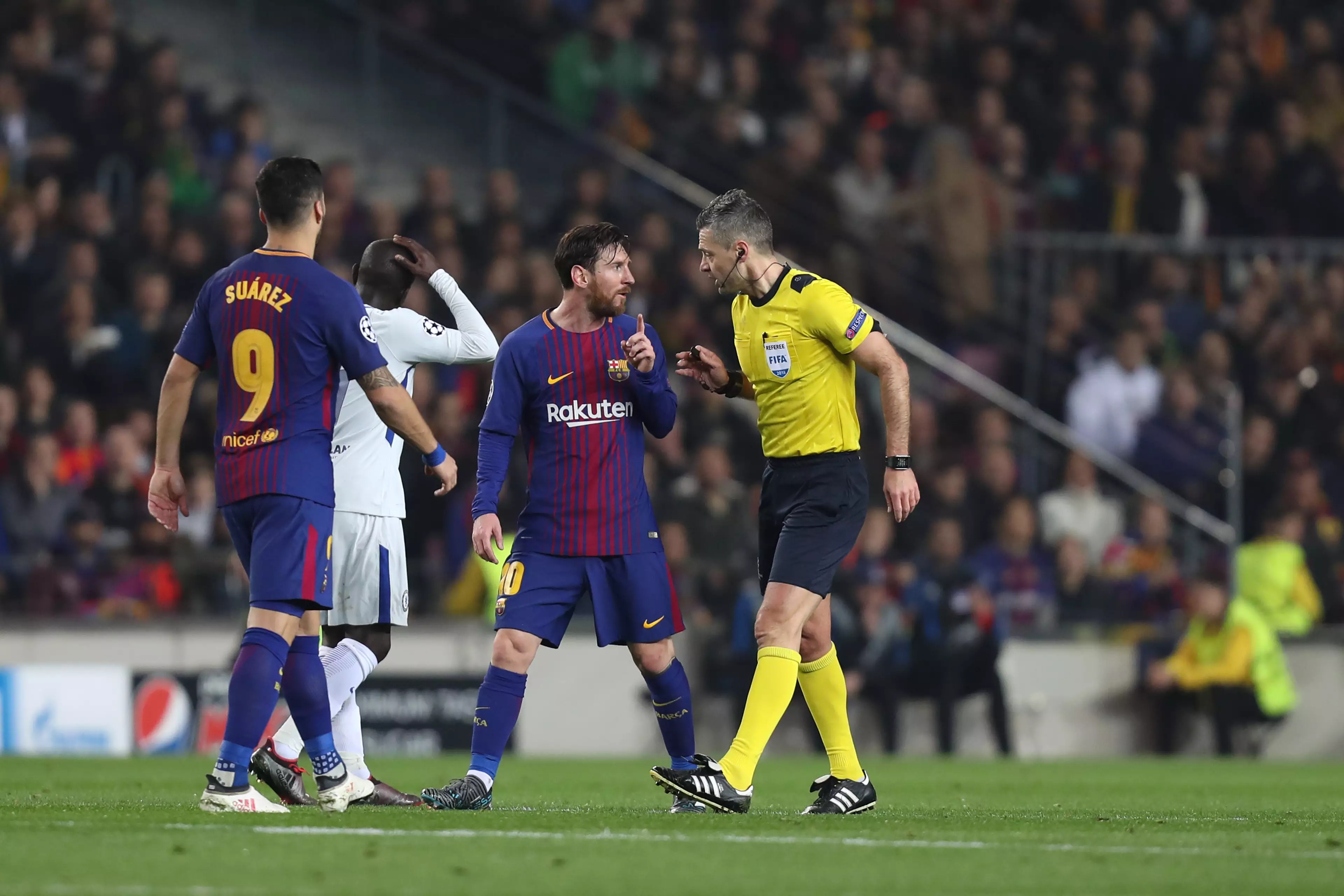 Messi swaps words with the ref. Image: PA