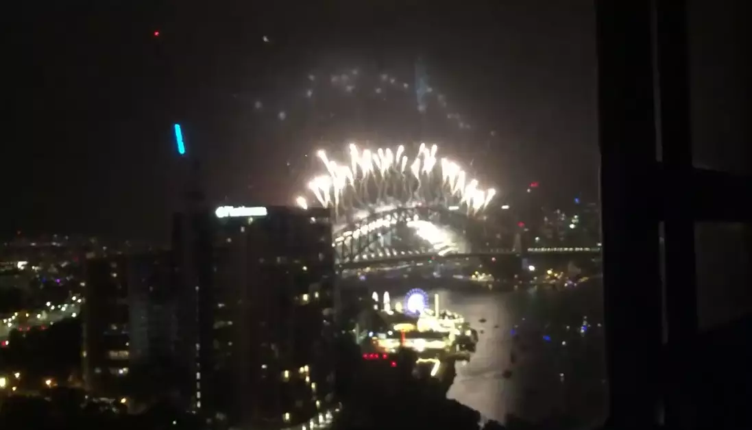 The camera then pans out to the Sydney Harbour fireworks.