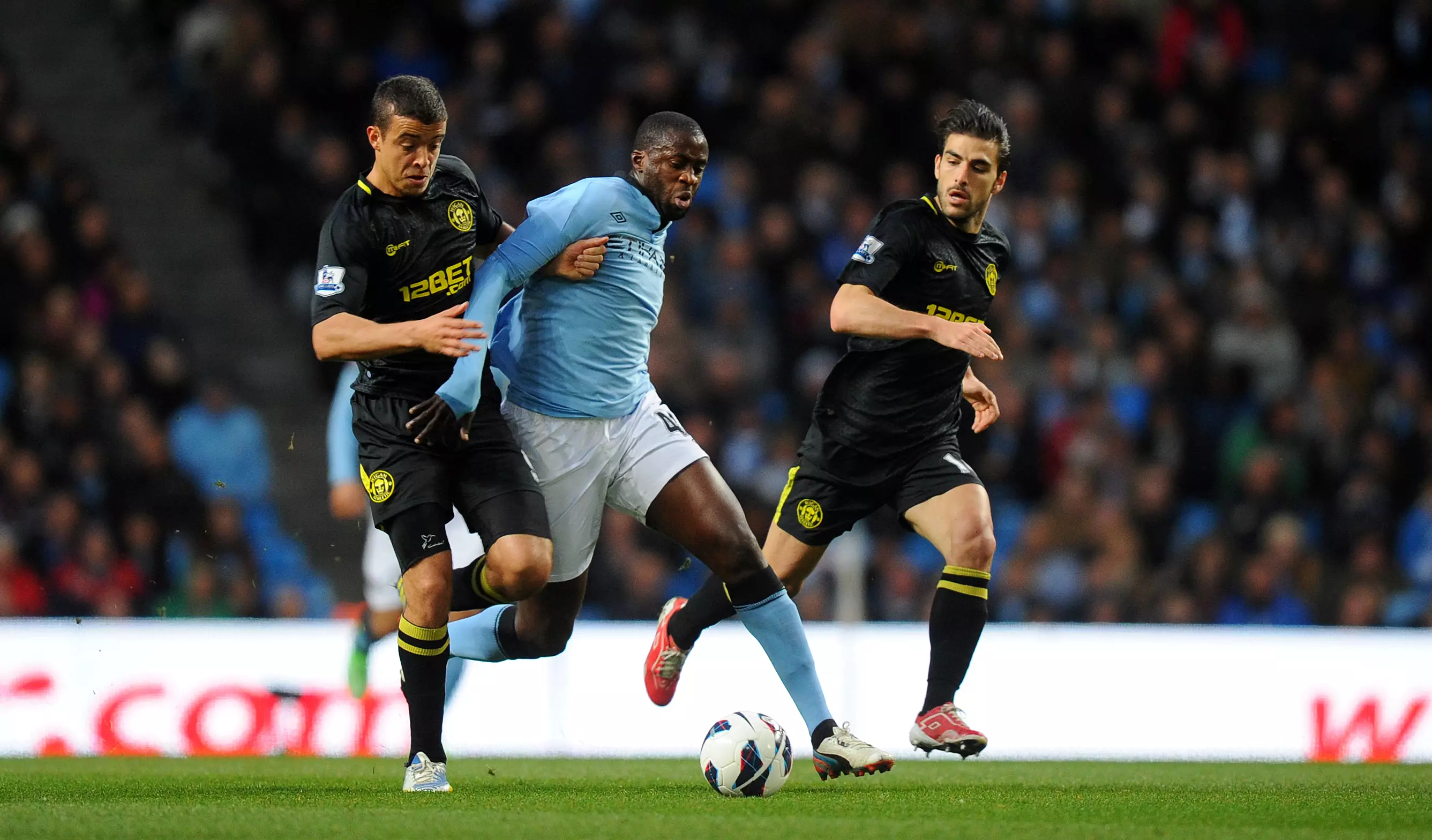 Toure gets his significant bum in the way of an opponent. Image: PA Images