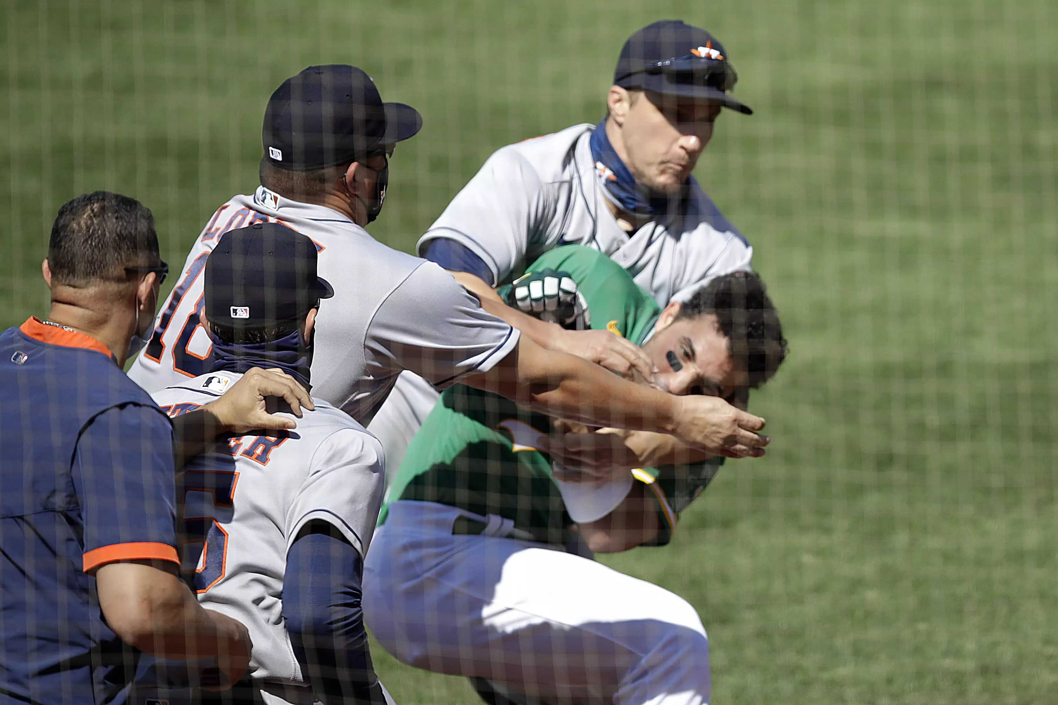 Laureano charges the Houston Astros' dugout.