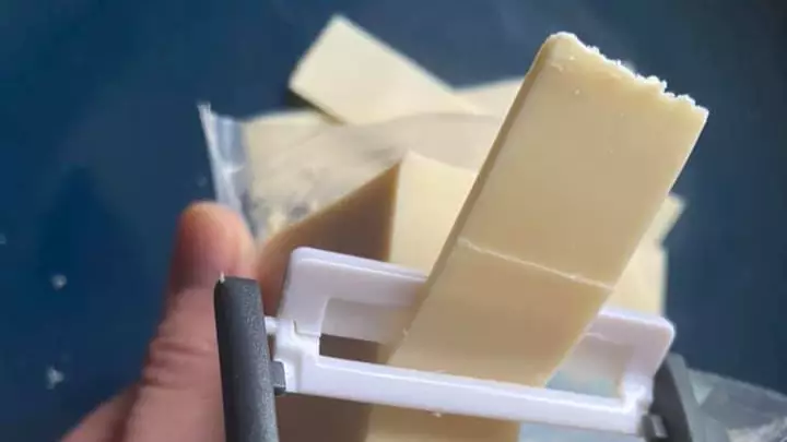 Woman Uses Potato Peeler To Get Perfect Slices Of Cheese