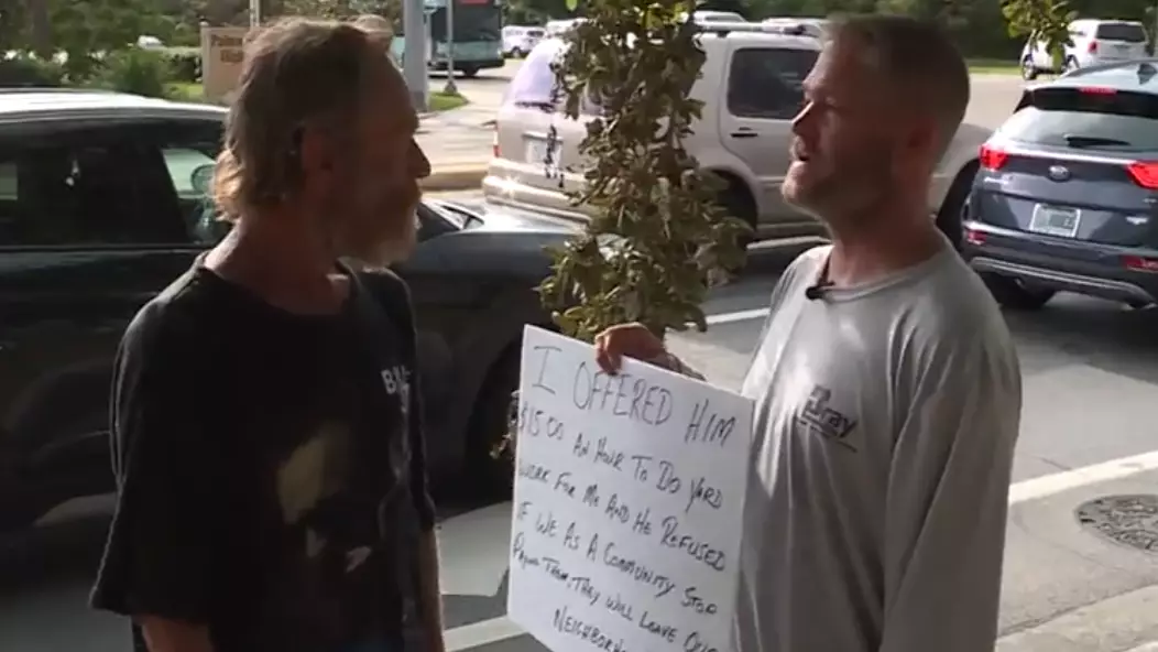 Man Makes Sign And Stands Next To Beggar Who Turned Down His Job Offer