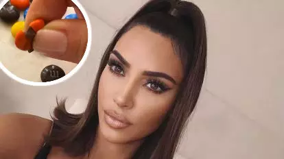 Kim Kardashian West Shares Her 'Life Changing Secret' To Eating M&M's 
