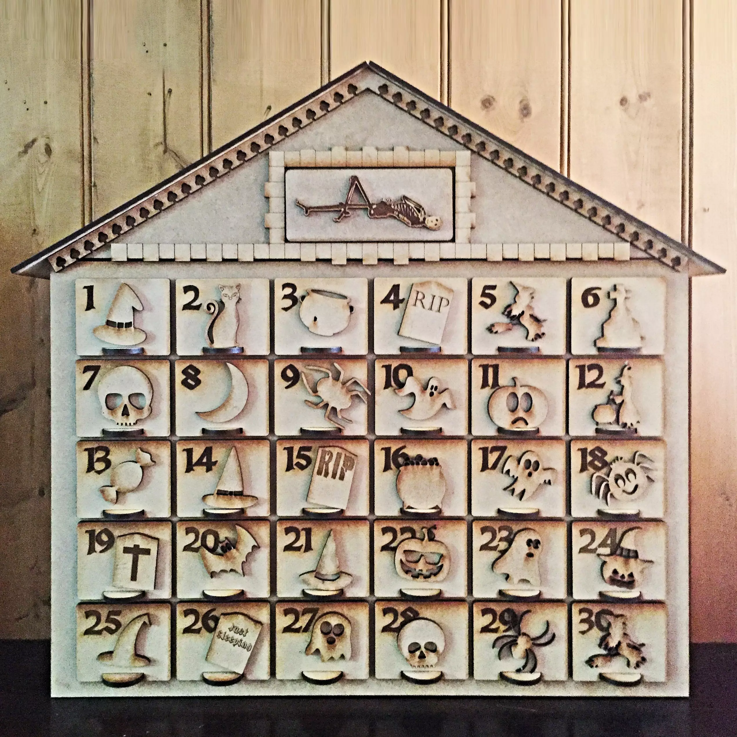 A wooden carved Halloween advent calendar is also available (