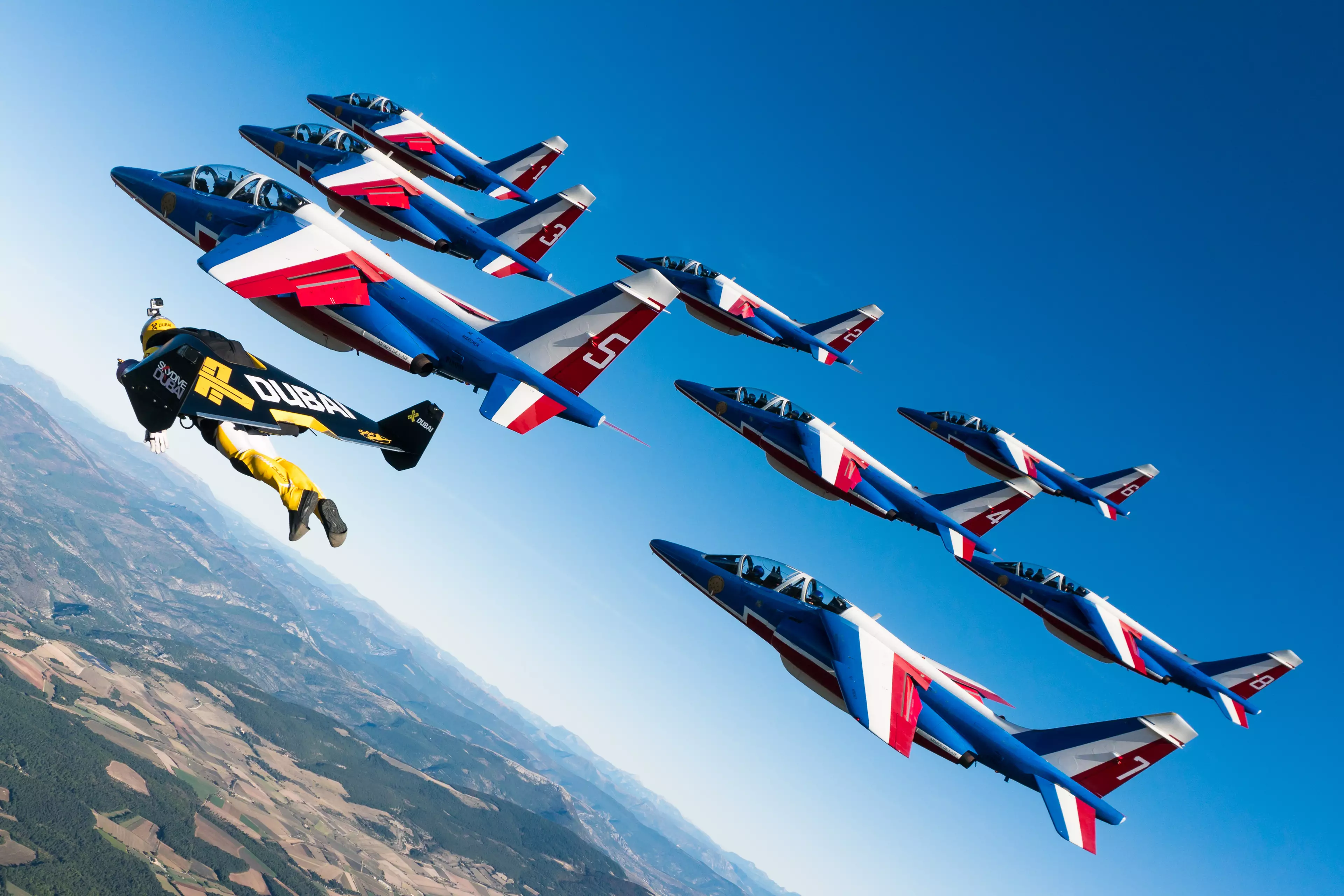 Reffet flies alongside French fighter jets in 2016.
