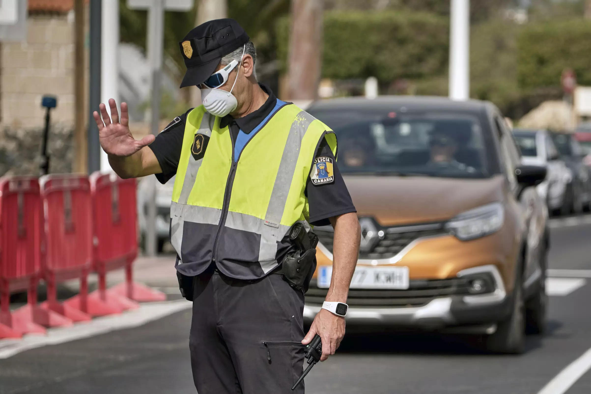 A police officer controls the road to the H10 Costa Adeje Palace hotel in Tenerife.