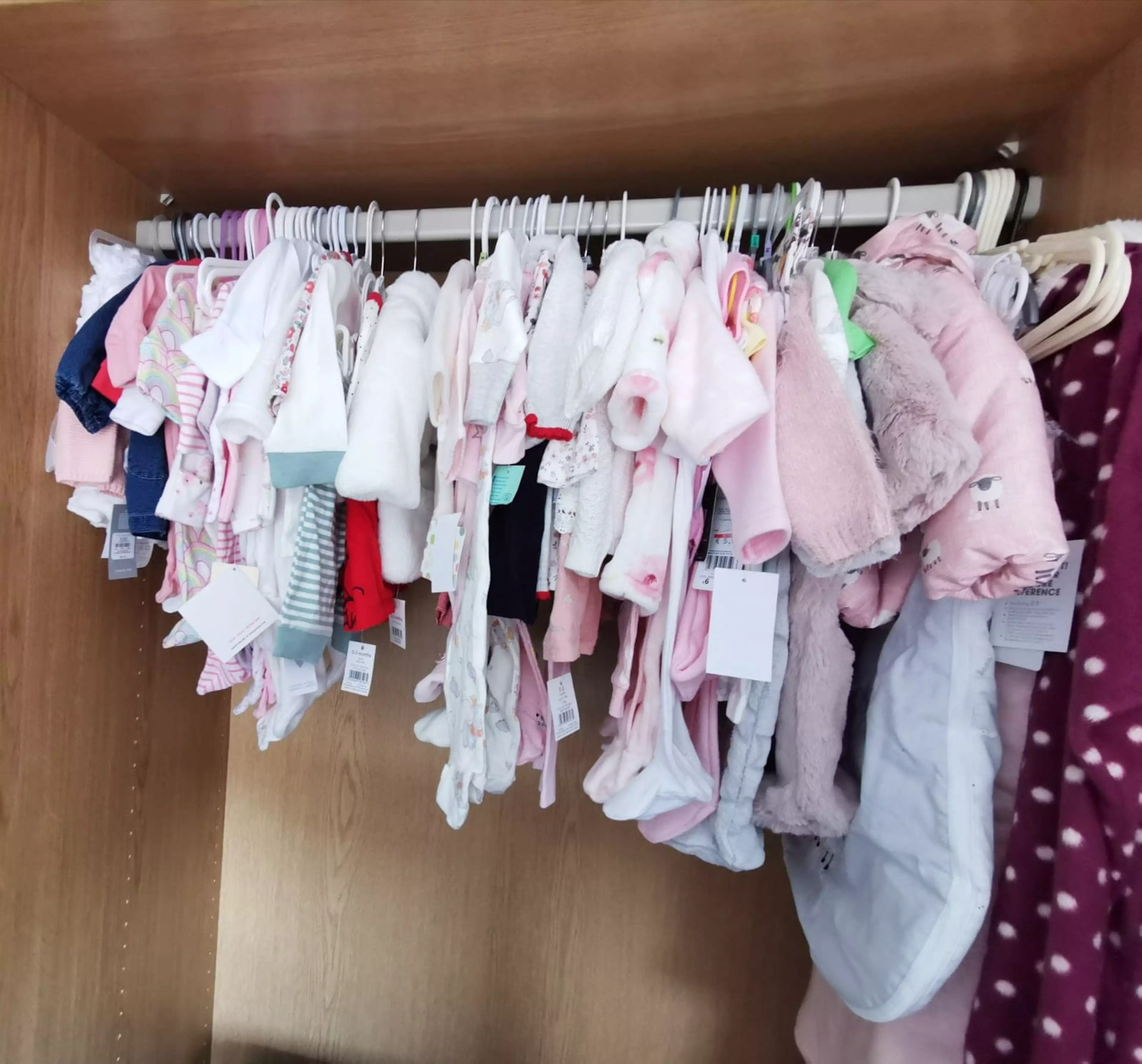 The family bought loads of pink clothes in anticipation of their new 'daughter'.