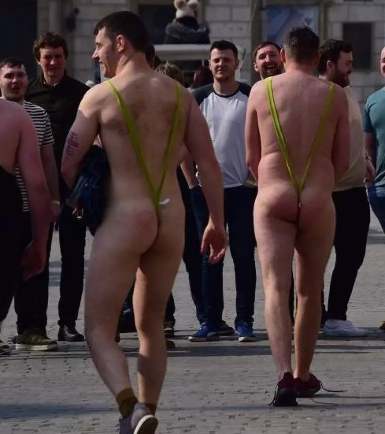 The men were seen parading through a Polish city, leaving little to the imagination.