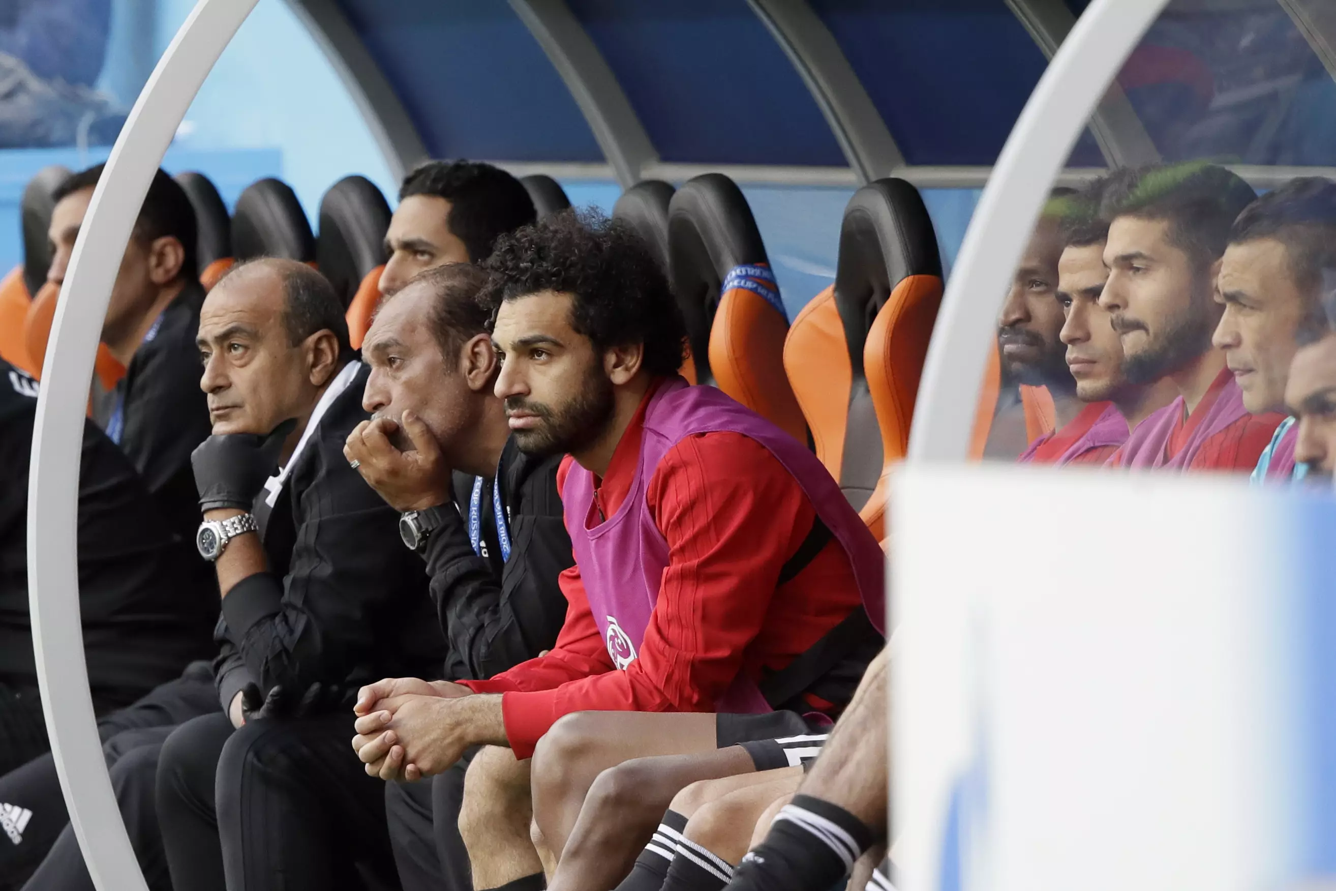 Salah watches on from the bench. Image: PA