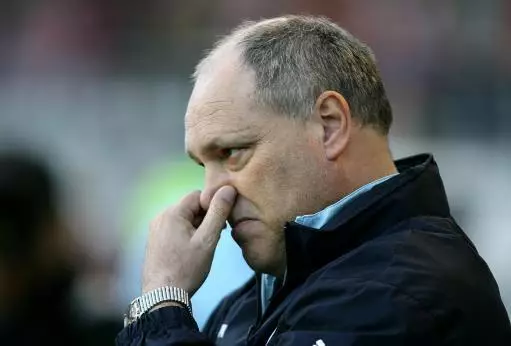 Martin Jol here, possibly trying to stop a fart invading his nostrils.