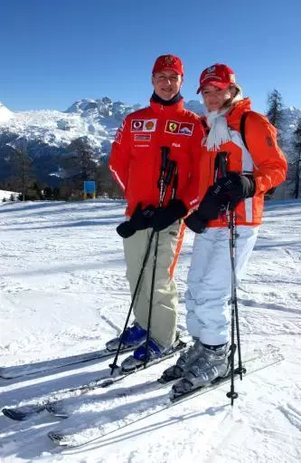 Michael Schumacher poses with his wife Corinna on a piste during the traditional three-day Ferrari meeting in Madonna di Campiglio.