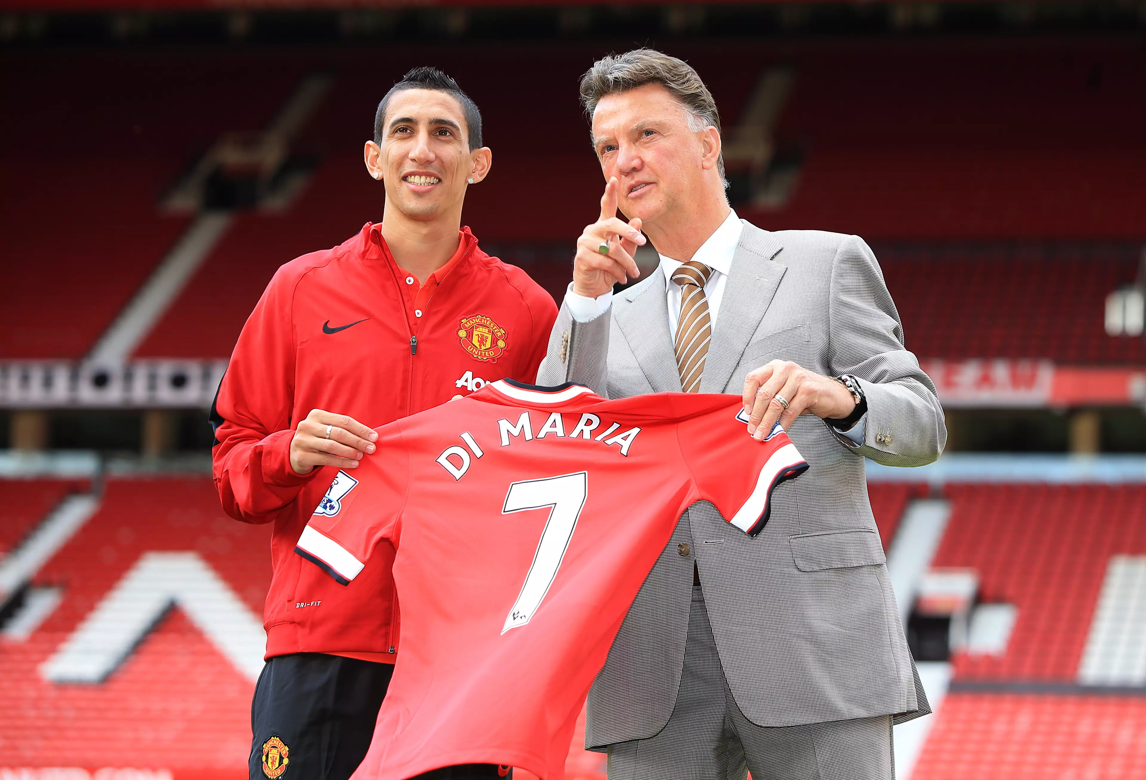 Van Gaal pointing at a plane that might take him and Di Maria away from Old Trafford. Image: PA Images