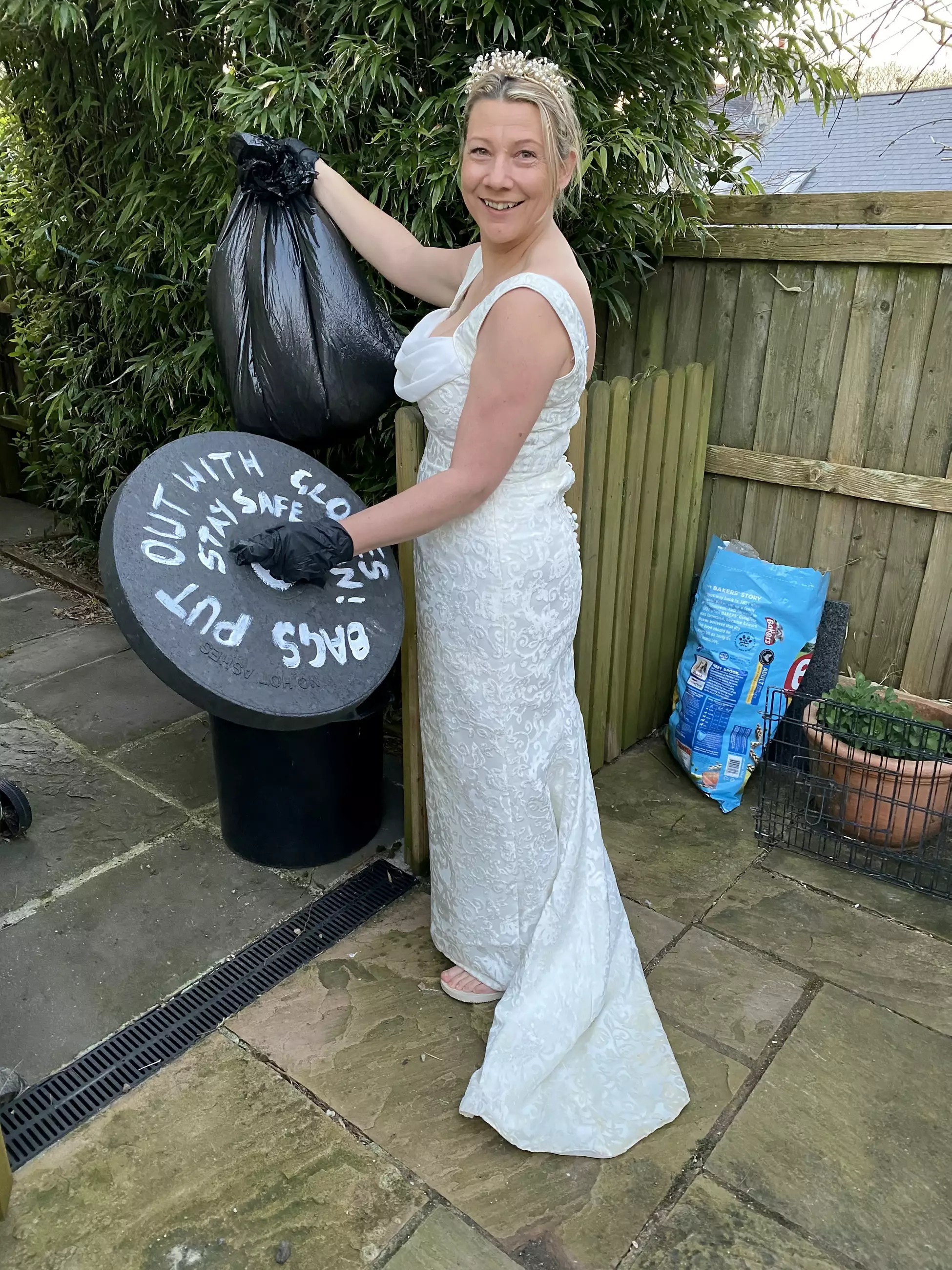 Binderella: another entrant donned her wedding dress to do the bins (