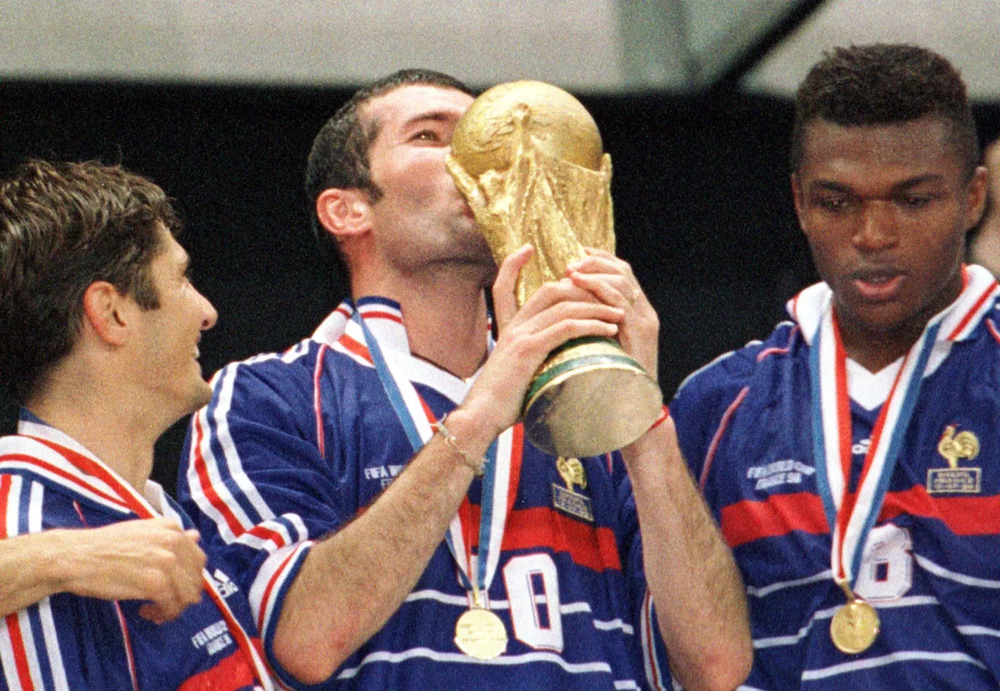 Zidane plants a kiss on the World Cup. Image: PA