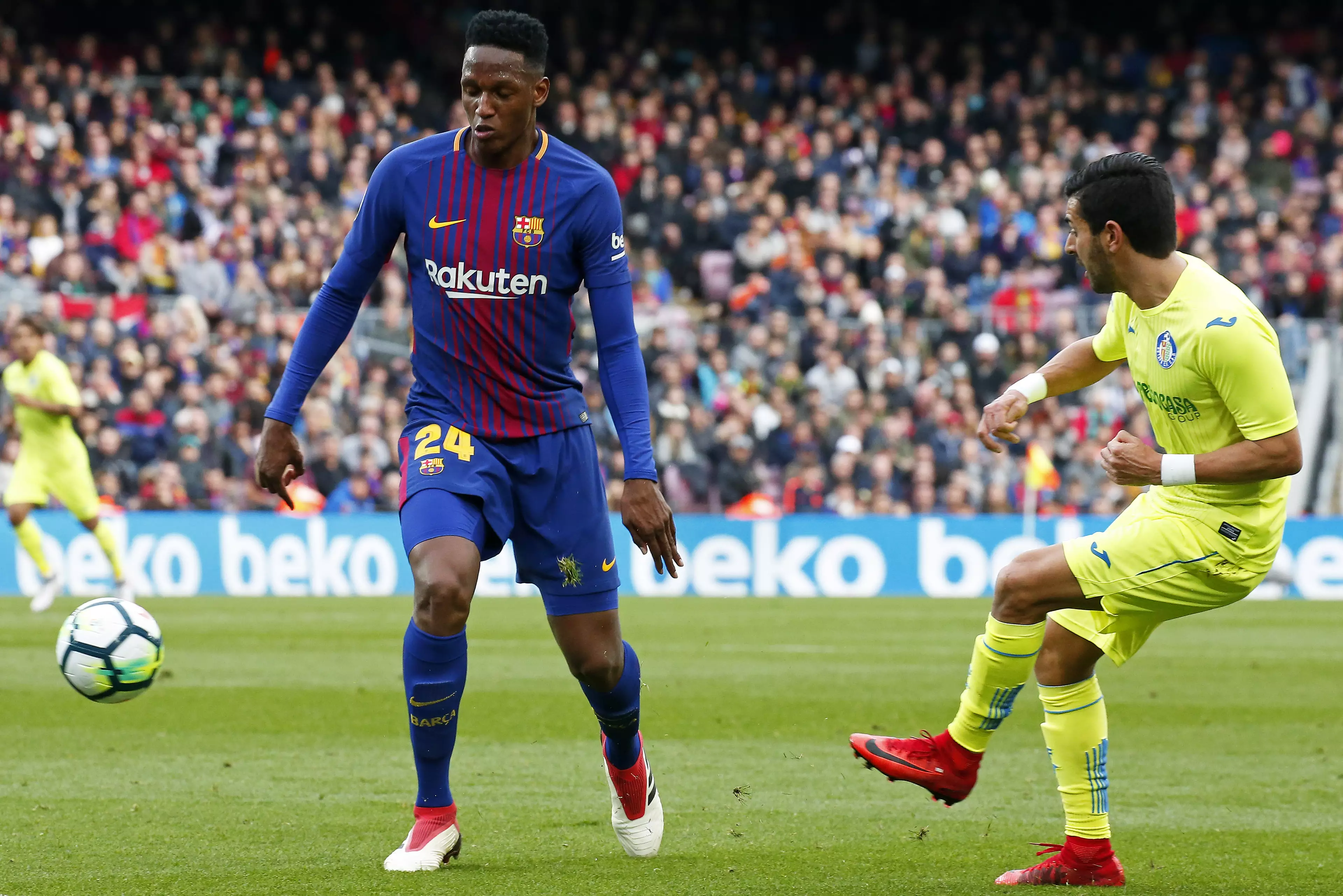 Mina in action for Barcelona. Image: PA