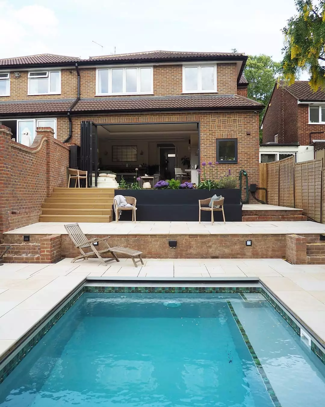 Today it's a plush outside space, pool and two storey extension (