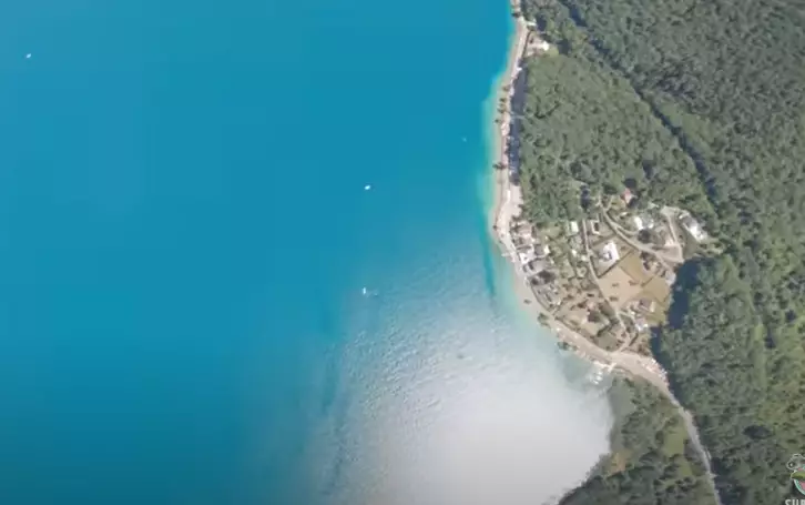 The iPhone plummeted into the lake below, never to be seen again.