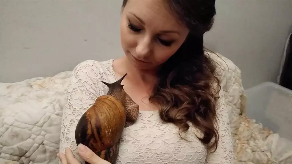 Woman Inseparable From Pet Snail Who She Talks To Every Day