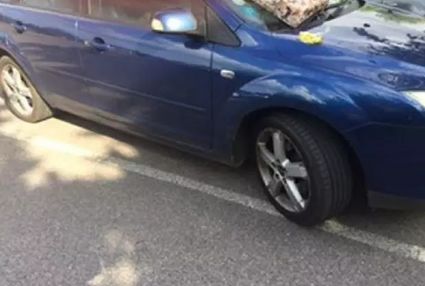 Woman parking over the line