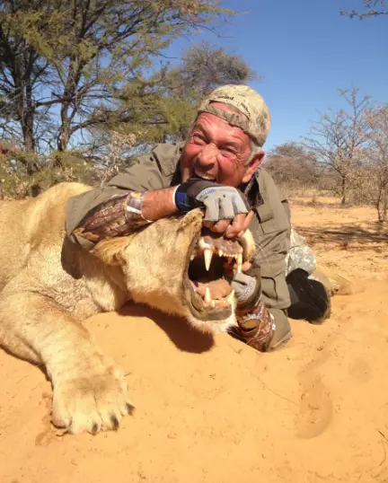 Jacques with the lion he killed.
