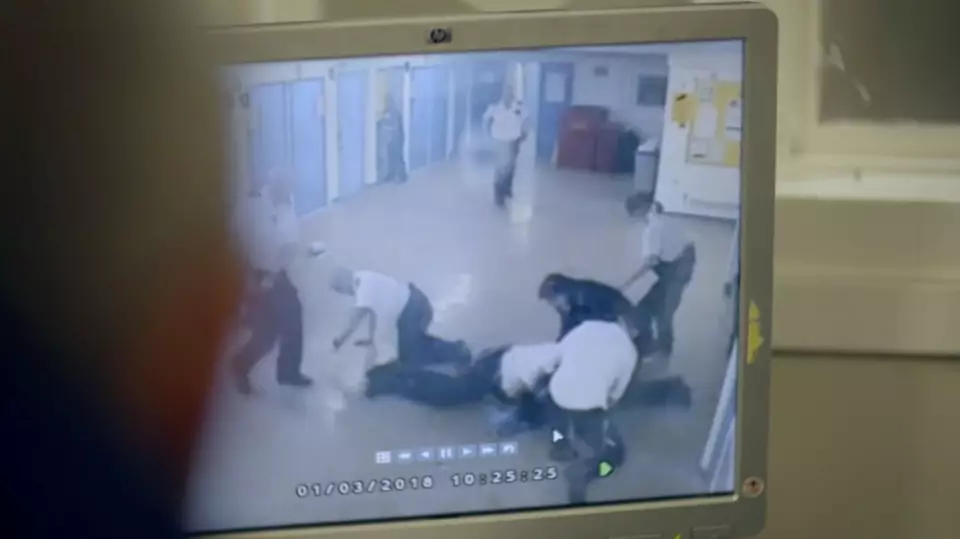 Prison officers review footage of a brawl in the show.