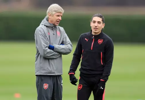 Bellerin and Wenger in conversation. Image: PA