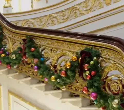 A garland also wraps around the grand staircase. (