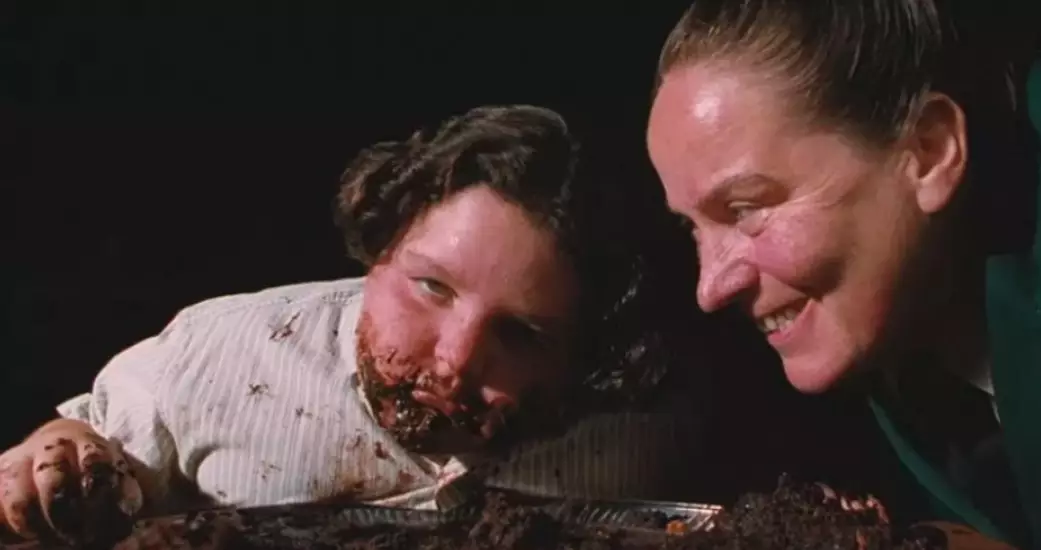 Bruce Bogtrotter is forced to eat a chocolate cake by Miss Trunchbull (