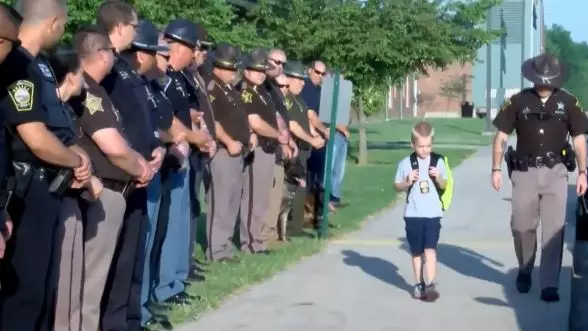 70 Indiana Officers Escort Boy To School After His Dad's Murder 