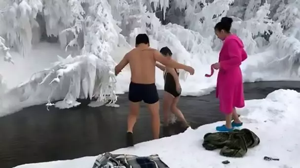 Russian Bathers Go For A Icy River Swim At -65C Temperatures