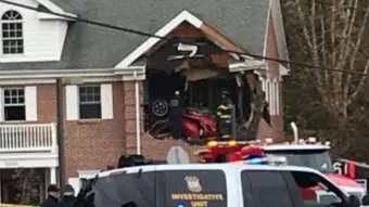 Two People Dead After Porsche Crashes Into First Floor Of Building