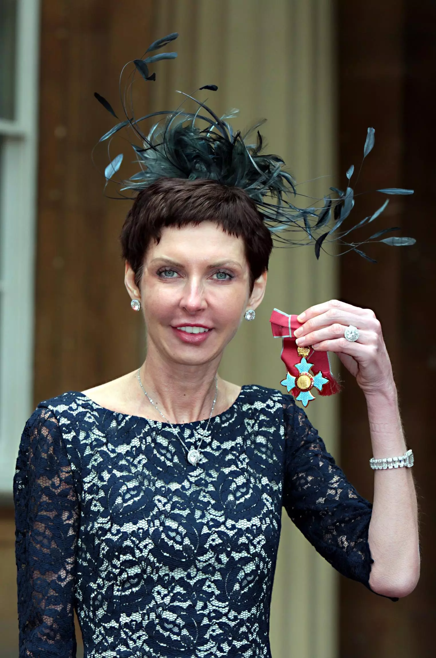 Denise Coates with her Commander of the British Empire (CBE) medal which was presented by the Prince of Wales in 2012.