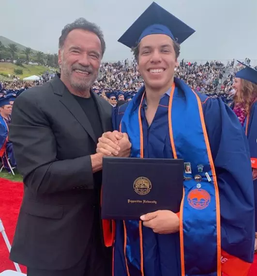 Arnie looked on as Joseph picked up his diploma from Pepperdine University.