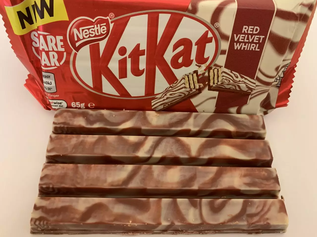 The KitKats have cream cheese swirls on top of the chocolate coating. (