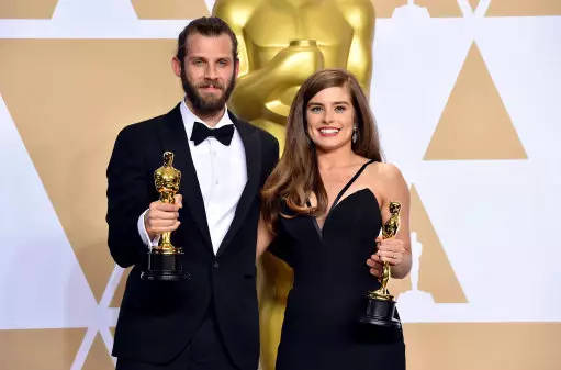 Rachel and Chris with their Oscar awards.