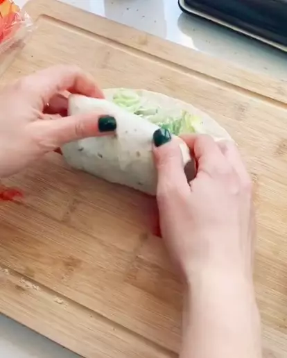 The TikTok user then folds the wrap from the bottom before cutting in half (