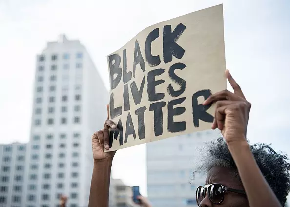'Iconic' Image Of A Woman Facing Police At 'Black Lives Matter' Protest Goes Viral 