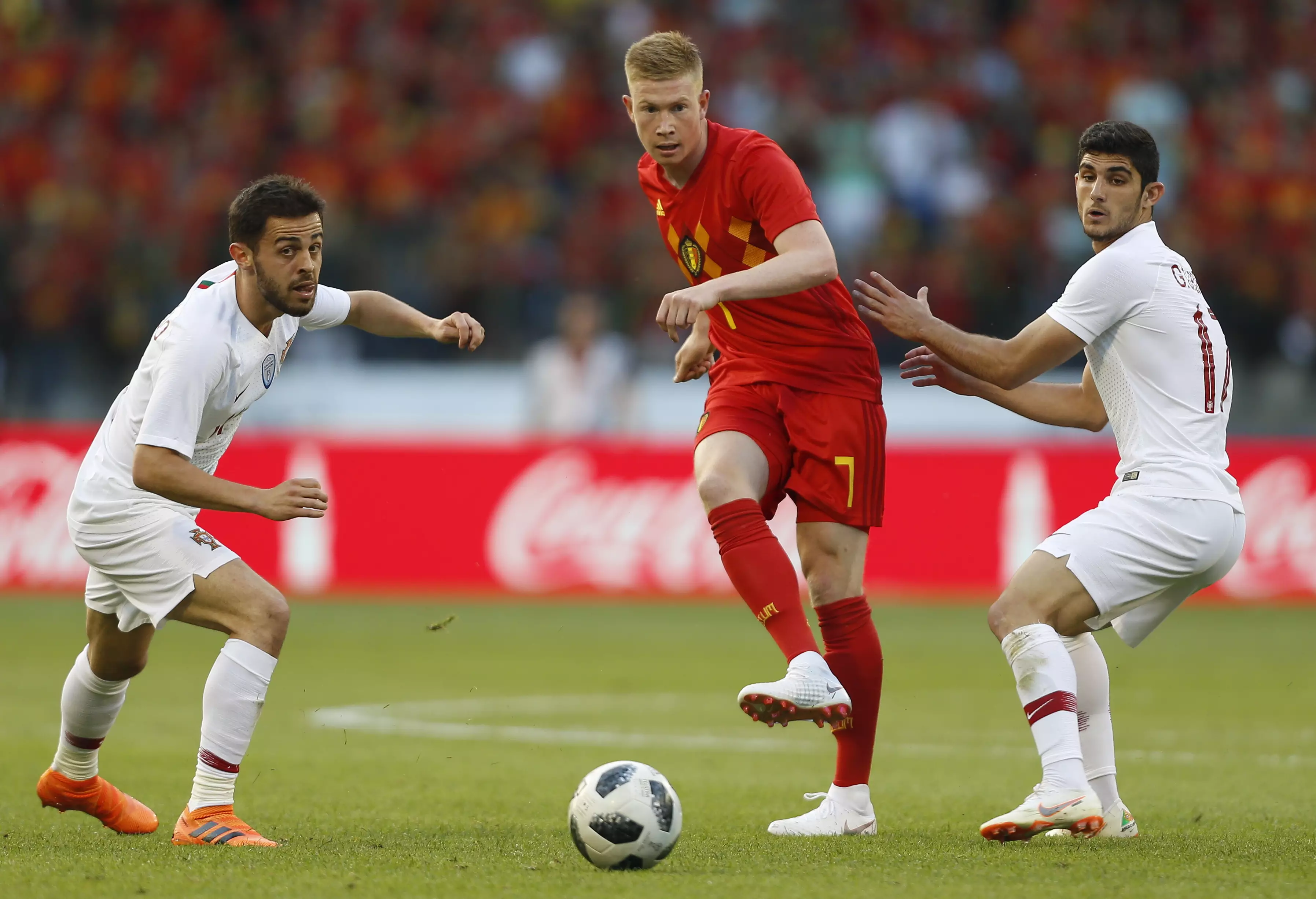 De Bruyne passes the ball in a friendly vs. Portugal. Image: PA
