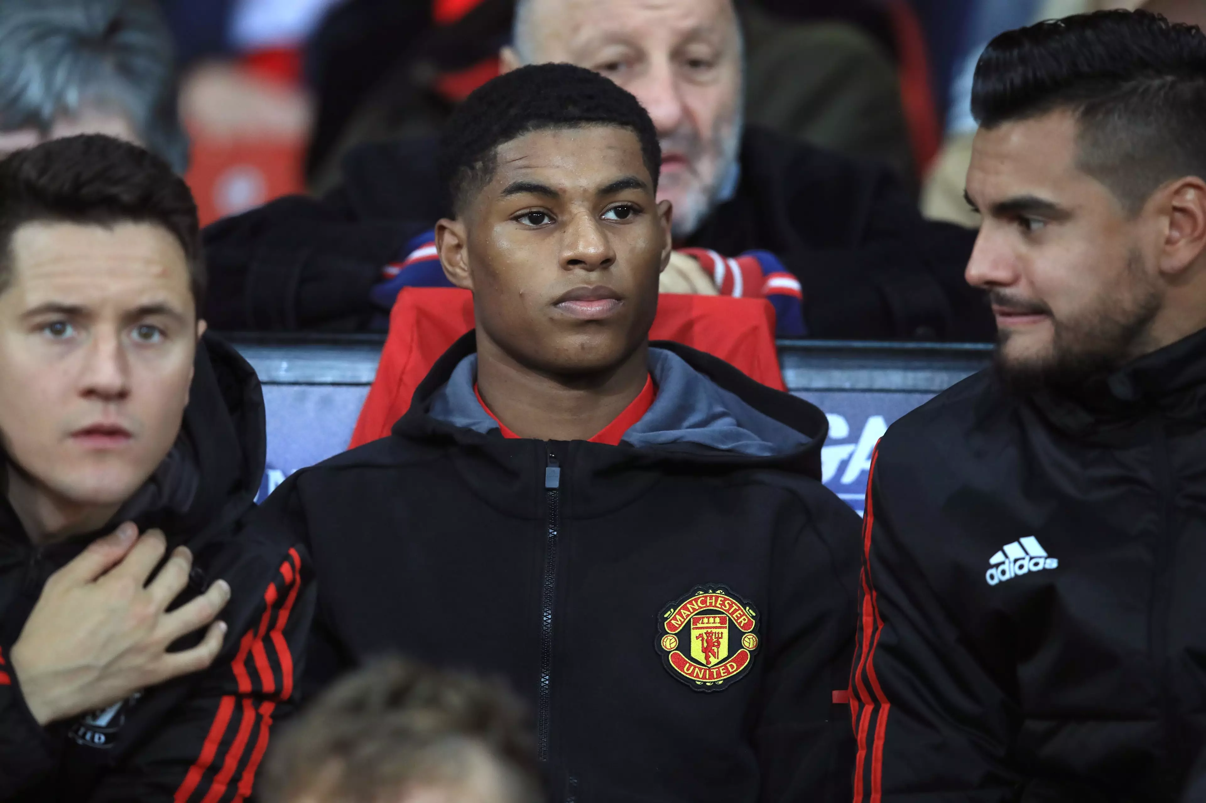 Rashford watches on from the bench. Image: PA