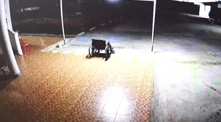 The wheelchair goes towards a ramp.