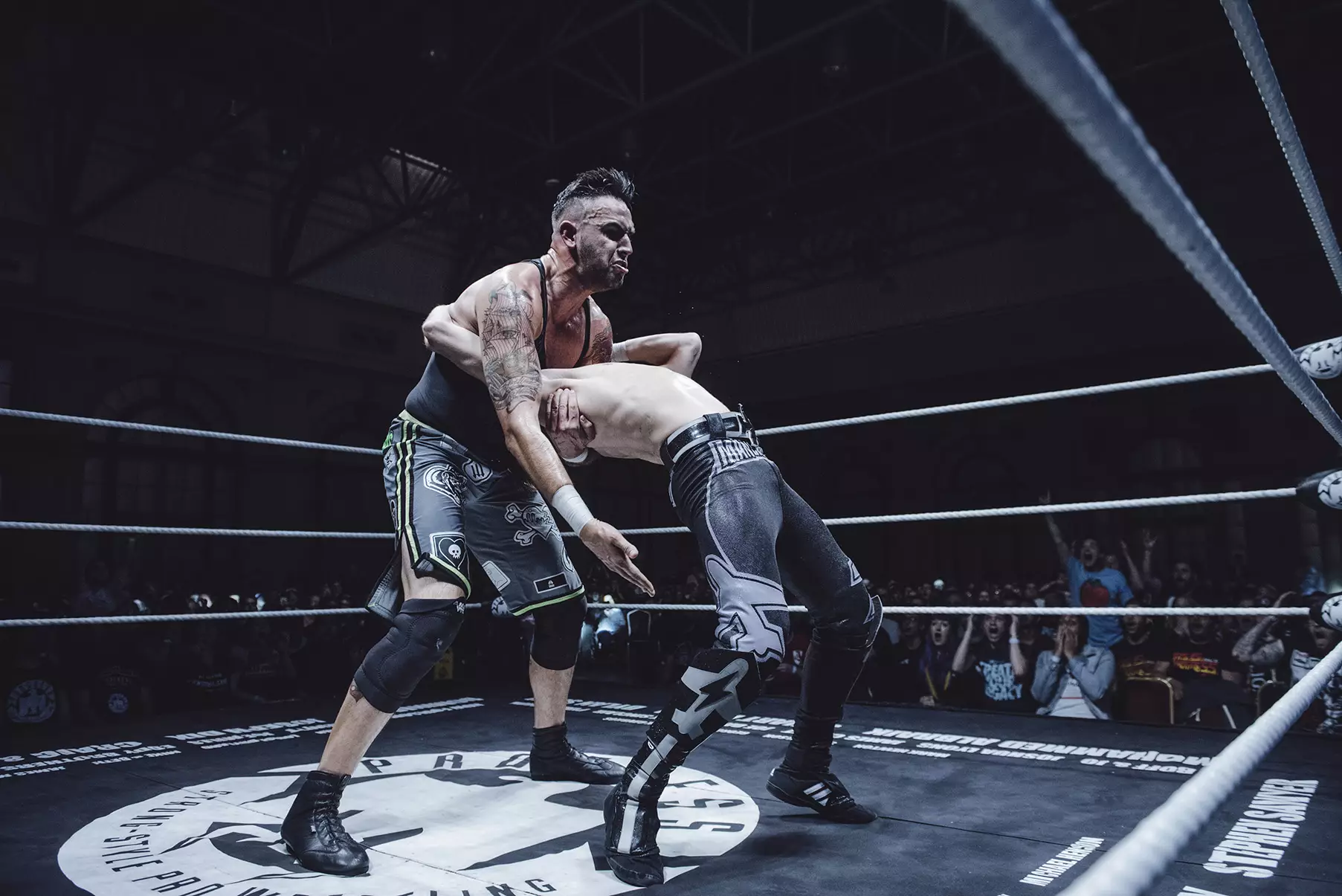 Dennis attacks his friend at Ally Pally. Image: The Head Drop/PROGRESS Wrestling